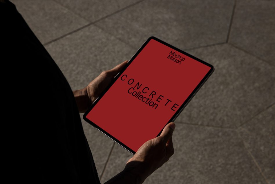 Hands holding tablet with red screen showing "CONCRETE Collection" mockup text