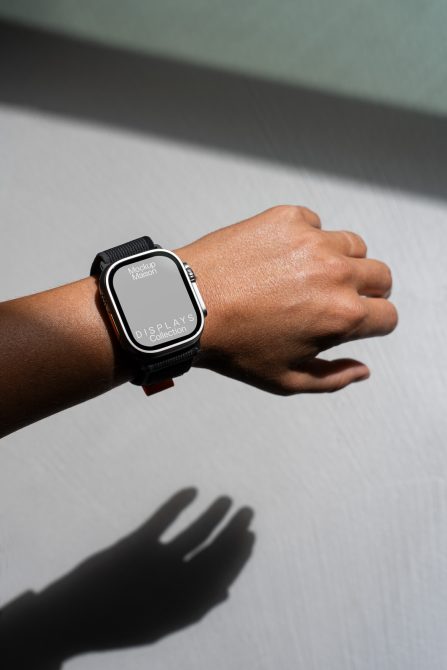 Wearable smartwatch mockup on a wrist casting shadow, ideal for showcasing UI/UX designs in a realistic setting, for the Mockups category.