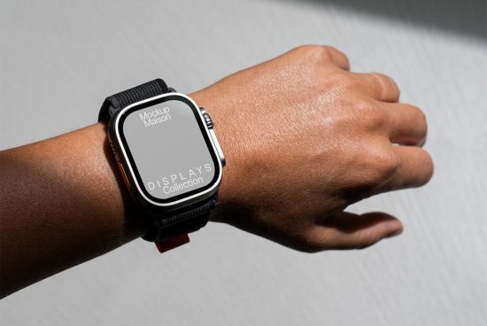 Smartwatch on wrist mockup for showcasing UI designs, worn by a person against a textured backdrop, ideal for graphics and templates designers.