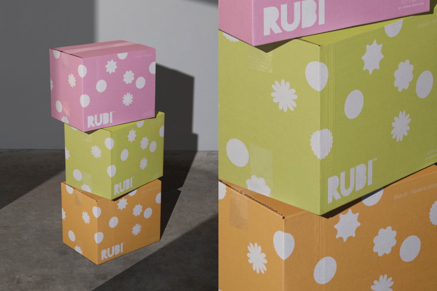 Three stacked colorful product boxes with floral patterns and branding in a bright setting, ideal for packaging mockup assets.