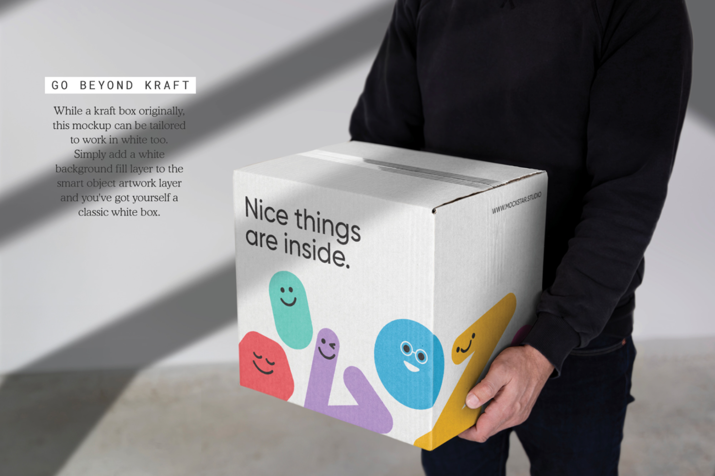 Man holding a package mockup with playful character designs, demonstrating box branding potential for designers and creative packaging ideas.