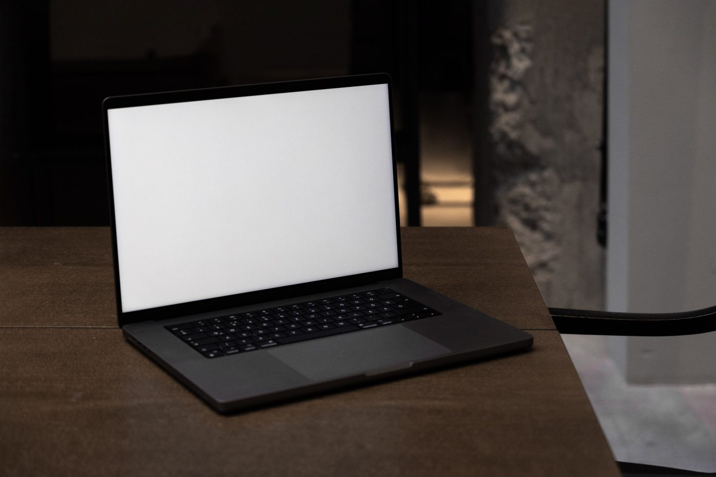 Laptop with blank screen on desk mockup, ideal for presenting web designs and applications to enhance digital portfolios for graphic designers.