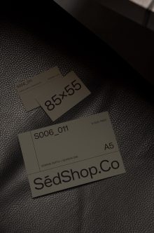 Stationery mockup with business cards plus A5 print on dark fabric