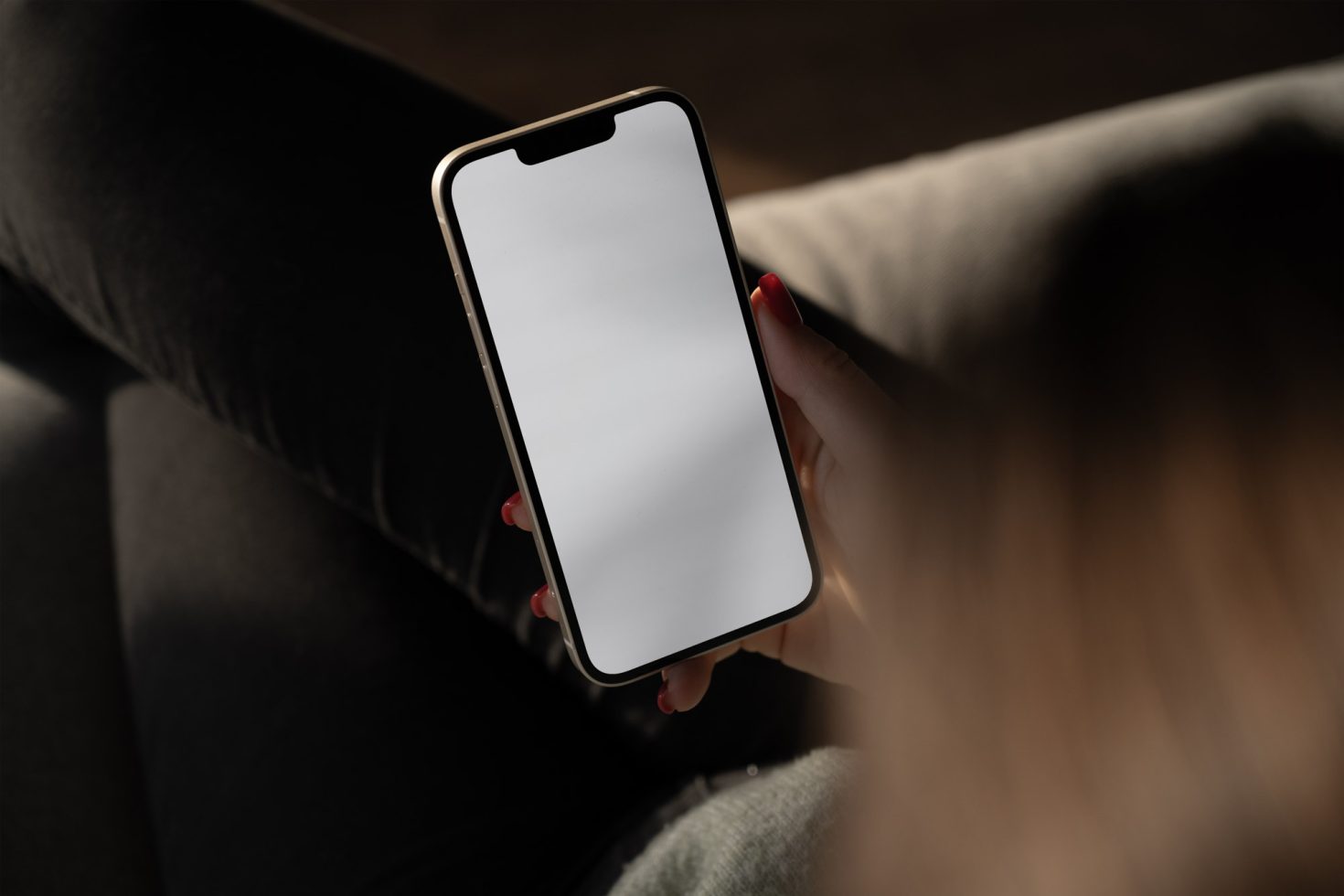 Woman holding smartphone with blank screen for mockup design, close-up, natural lighting, tech digital asset.