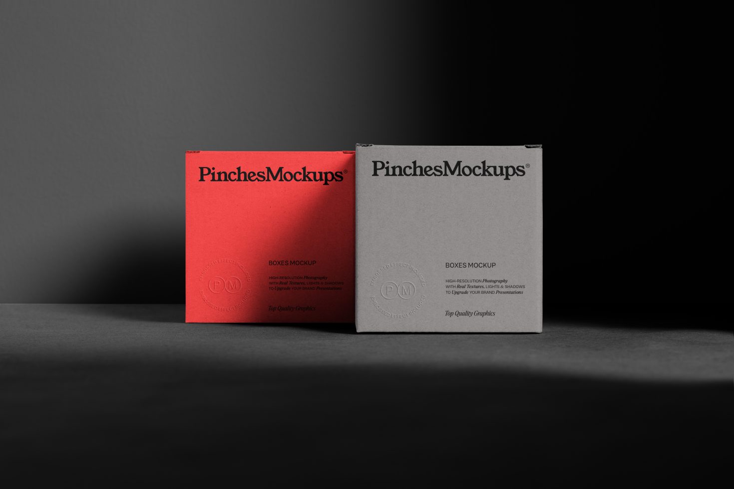 Red and grey product boxes mockup with branding in a studio setting, ideal for presentations and packaging design visualizations.