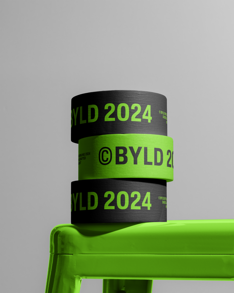 Stack of black and neon green design mockup wristbands with text BYLD 2024 on a neon green chair against a gray background.