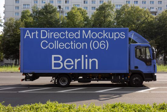 Blue truck with Art Directed Mockups Collection 06 Berlin text parked on a street. Ideal for designers needing realistic mockups, templates, and graphic assets.