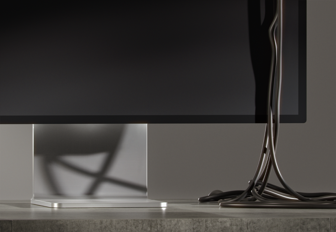 Close-up of a modern monitor base with cable organization on a minimalist desk setup. Ideal for mockups digital assets for designers. Clean workspace design.