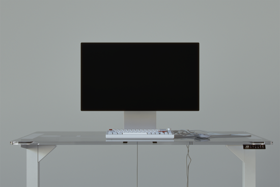 Minimalist workspace mockup featuring a computer monitor and keyboard on a glass desk perfect for designers digital assets sleek clean modern template productivity
