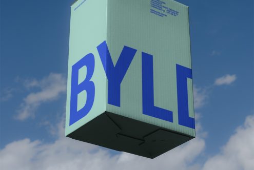 3D floating cardboard box mockup with bold blue typography against sky background, ideal for packaging design and branding presentations.