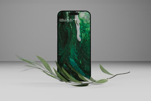 iPhone 15 Pro Max mockup template with marble background and greenery, perfect for graphic designers and digital asset creators for realistic presentations.