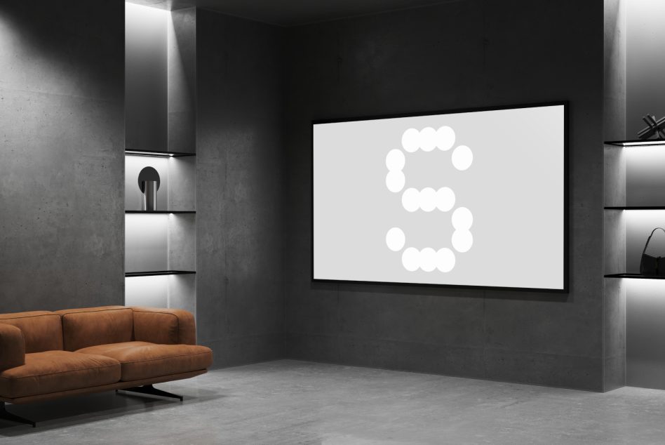 Modern living room interior mockup with minimalist furniture, dark walls, and large screen displaying a dotted S. Perfect for showcasing design templates.