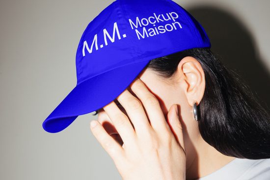 Blue cap mockup on a female model covering face, ideal for branding presentations in design assets marketplace.