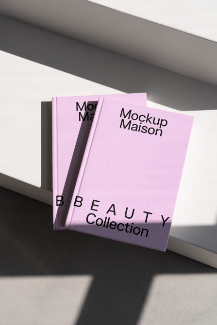 Pink hardcover book mockup featuring black font text BBEAUTY Collection. Ideal for showcasing book cover designs. Keywords: book mockup, hardcover, design.