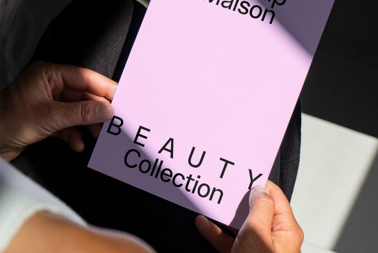Closeup of hands holding a lavender mockup template for a beauty collection brochure with modern typography under sunlight. Ideal for designers, graphics.