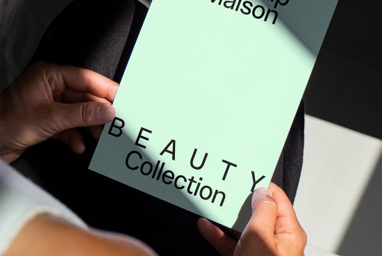 Person holding a mint green beauty collection pamphlet, ideal for designers. Perfect graphic asset for mockups, templates, fonts, and marketing materials.