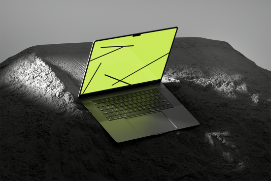 Laptop mockup with a yellow screen displaying abstract lines on a textured surface. Ideal for showcasing website designs, UI elements and digital assets for designers.