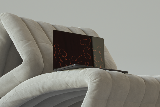 Laptop mockup on a gray cushioned chair showcasing modern design patterns. Perfect for showcasing digital assets, website designs, and software interfaces.
