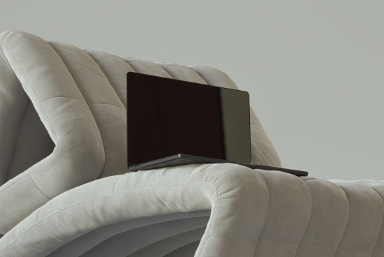 Laptop mockup on beige cushioned chair modern minimalist design digital assets for designers high-resolution mockups templates creative workspace branding