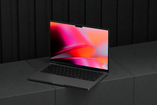Laptop mockup with vibrant pink screen displayed on dark textured surface ideal for designers digital assets marketplace mockups templates graphics