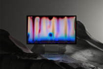 Monitor mockup with colorful audio waveform display in moody landscape setting