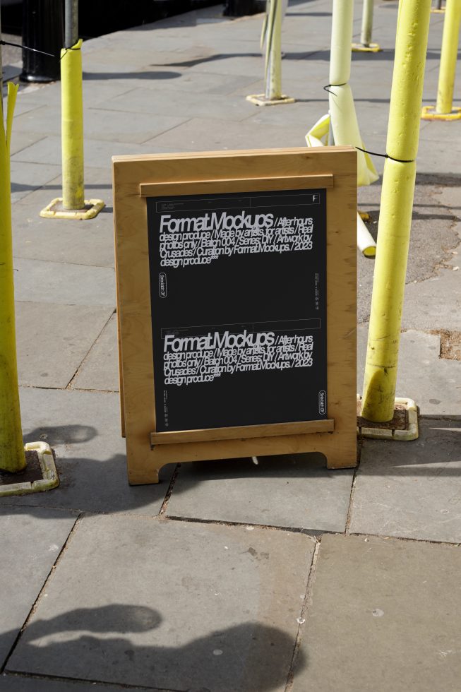 Street mockup of a wooden A-frame sign with black posters, ideal for showcasing template designs. Perfect for designers looking for real-world presentation mockups.