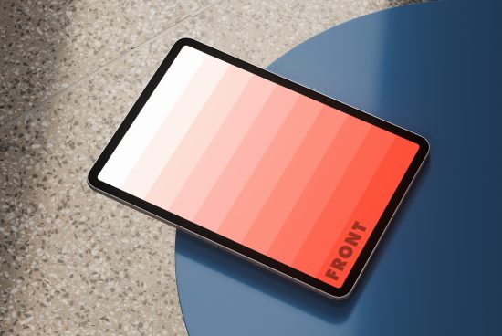 Tablet mockup with gradient color screen leaning on a blue surface suitable for digital design presentations and user interface displays. Suitable for designers.