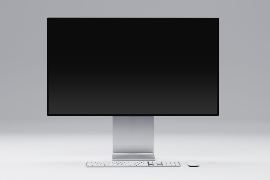 Desktop monitor setup mockup with keyboard showing blank black screen