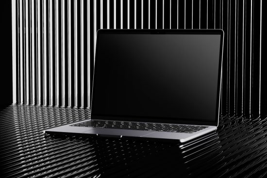Laptop mockup with blank screen for designers, displayed in a modern black and white environment with striped reflections. Ideal for showcasing web designs.