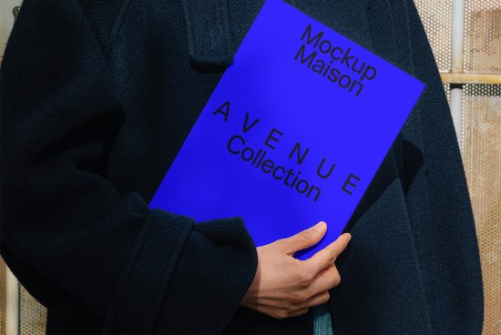 Person holding a bright blue magazine Mockup Maison Avenue Collection. Ideal for designers seeking magazine mockups digital assets for portfolio presentations.
