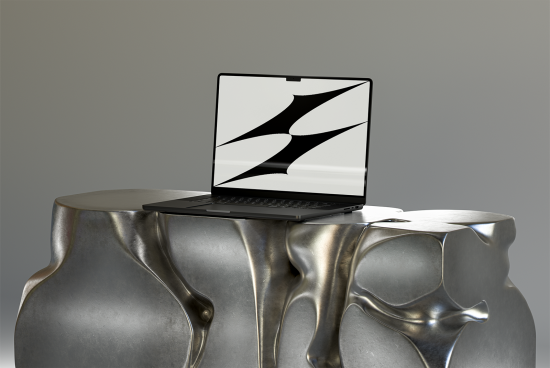 Open laptop on artistic metal table grey background, screen displaying abstract design; suitable for mockups templates or graphic resource for designers.