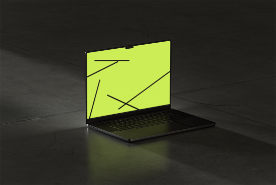 Laptop mockup with blank neon green screen on dark floor background for graphics design templates digital assets showcasing modern workspace SEO optimized