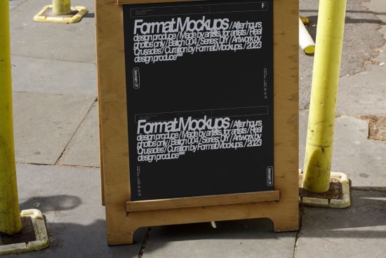 Wooden stand displaying two black posters with white text for Format Mockups, positioned on a city sidewalk. Ideal for showcasing design or typography.
