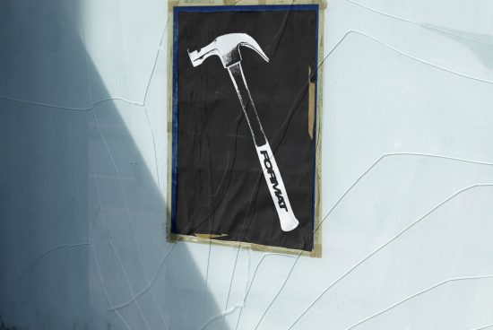 Realistic poster mockup featuring a hammer design on a textured wall. Ideal for showcasing branding or graphic designs. Template for designers.