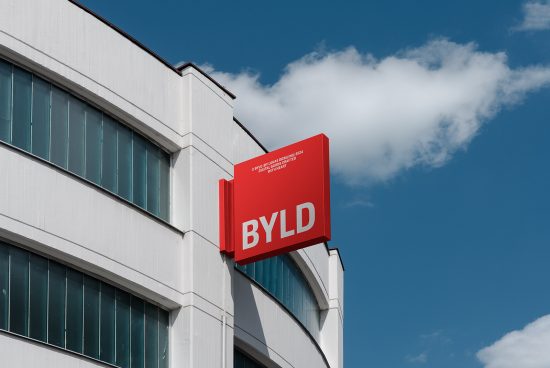 Building facade with a red BYLD signage against blue sky designers digital assets mockup template architecture realistic outdoor branding display modern clean design