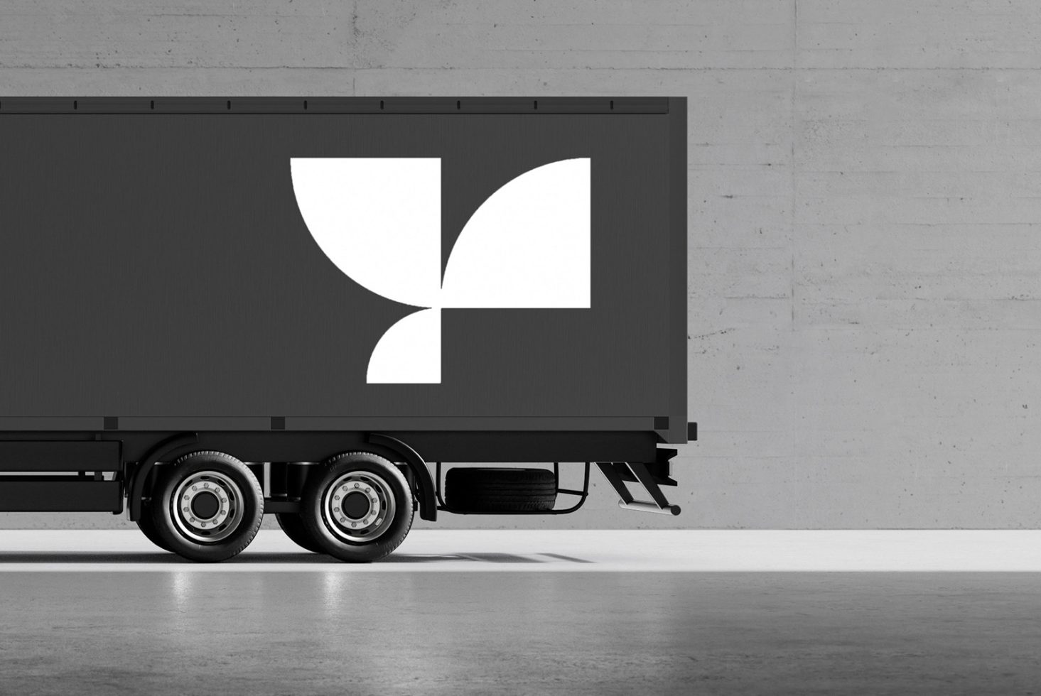 Side view of a black truck with a modern geometric logo, useful for branding mockups, graphic design projects, digital assets, templates for designers.