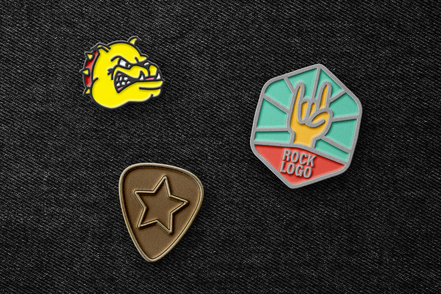 Set of three enamel pins on black fabric each with unique designs bulldog face star rock logo for mockups graphics accessories designers high quality