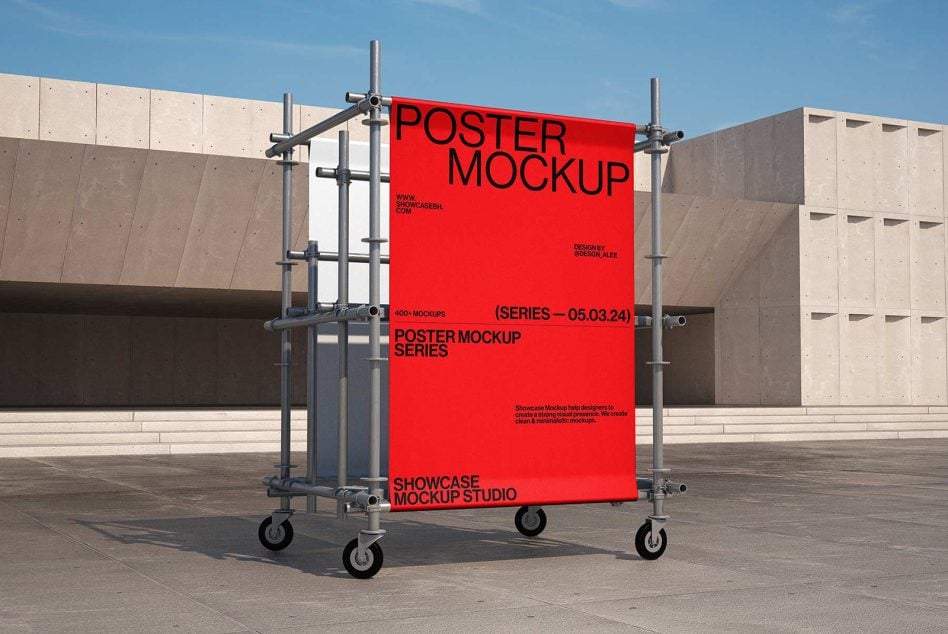 Bright red poster on wheeled metal framework in paved outdoor space