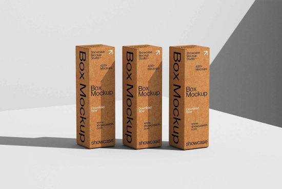 Three brown cardboard box mockups arranged in a row on a minimalist grey background, ideal for showcasing packaging designs. Keywords: mockups, packaging, box.