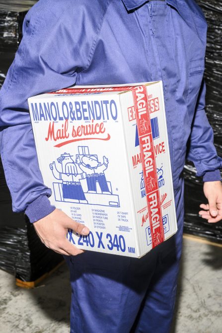 Person in denim jacket holding large white mail service box with red blue vintage illustration