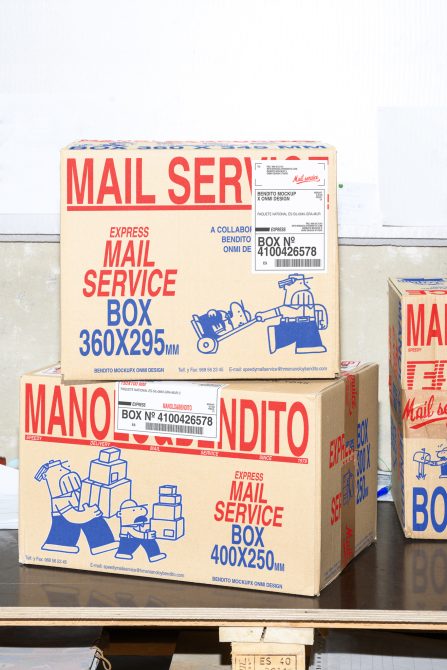 Cardboard express mail service boxes with red and blue text stacked, showcasing packaging design mockup. Ideal for graphics and templates categories.