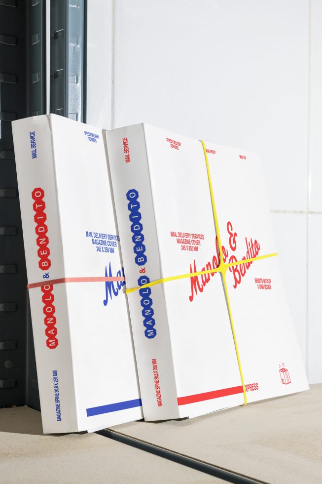 Magazine mockup covers in white with red and blue text, bound by rubber bands. Perfect for showcasing design and branding projects to designers.