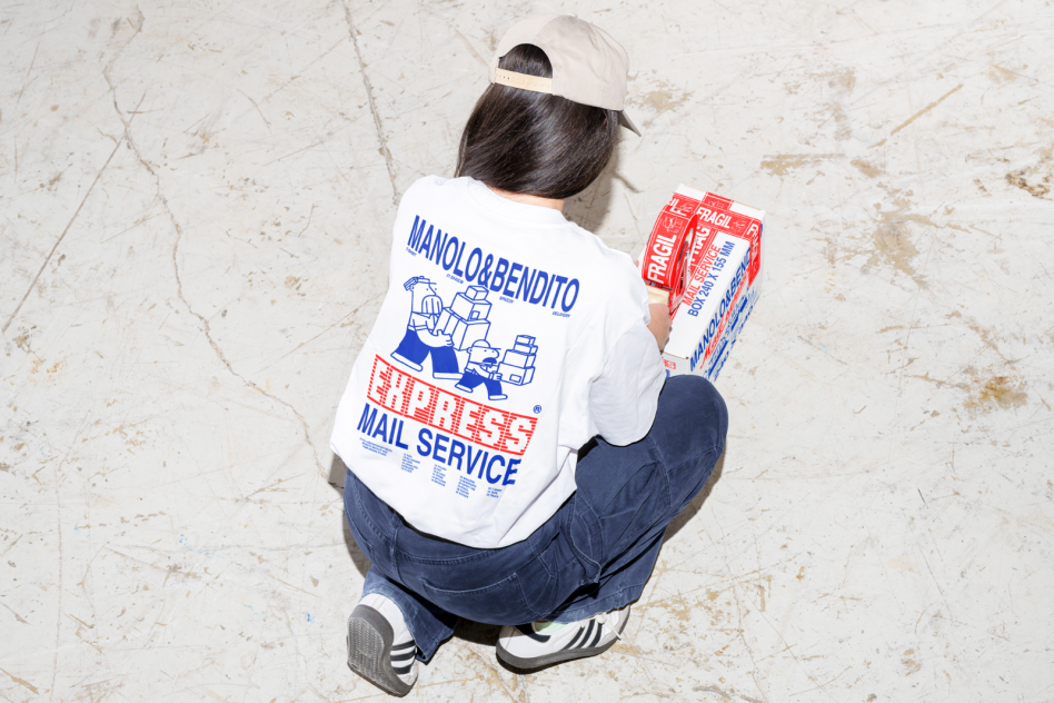 Person in branded express mail service t-shirt holding mailing boxes on concrete floor perfect for mockups and design projects. Keywords: Mockups, Graphics, Templates.