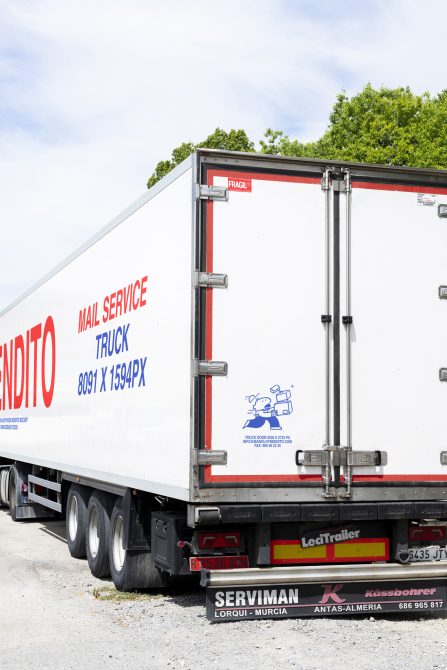 Mockup of a white mail service truck with red accents parked on a sunny day, useful for designing delivery service graphics, templates, and logistics branding.