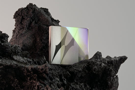 3D book mockup with holographic cover set on volcanic rock background, perfect for design presentations and showcasing creative book cover designs.