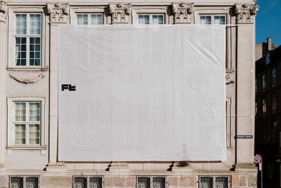 Large blank billboard mockup on old city building. Perfect for customizable advertising design, marketing templates, and graphic presentations.