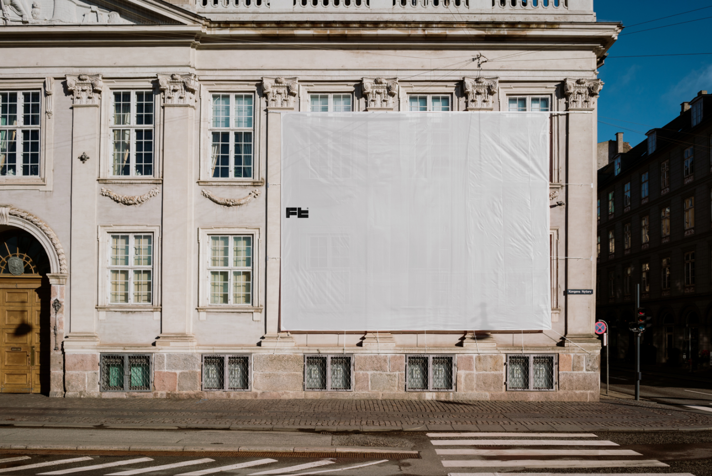 Building facade banner mockup. Large blank advertising space on urban European classic architecture. Ideal for marketing presentations and design templates.