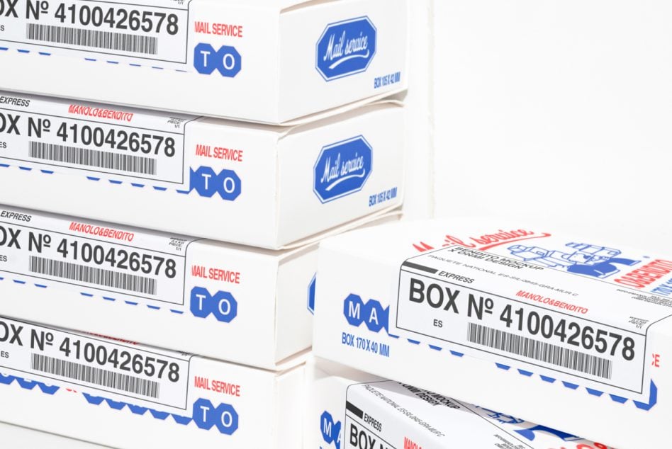 Stack of cardboard mailers with blue mail service branding, delivery labels visible