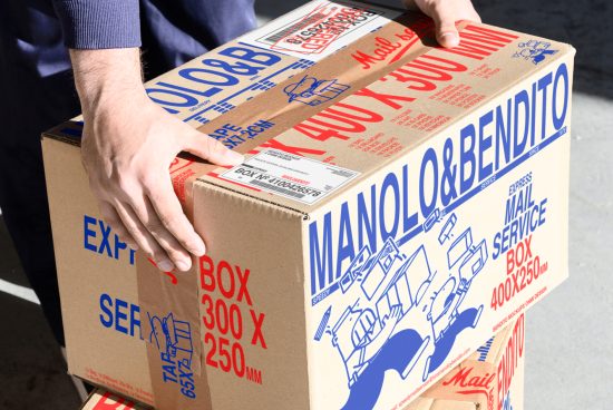 Person handling a large cardboard box with vibrant blue and red typography. Suitable for packaging design mockups or product display templates.
