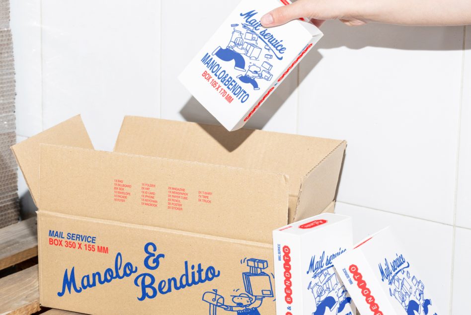 Hand holding white mail service box with blue red graphics over cardboard shipping boxes